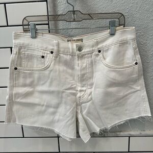 Free people we the free IVY raw hem mid rise denim shorts in Crystal clear